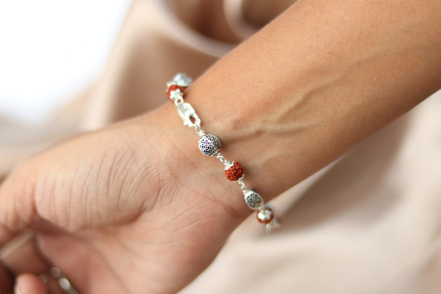 Wearing Silver Rudrkahsa bracelet in Hand